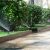 Work of automatic lawn watering system on the street in the city.